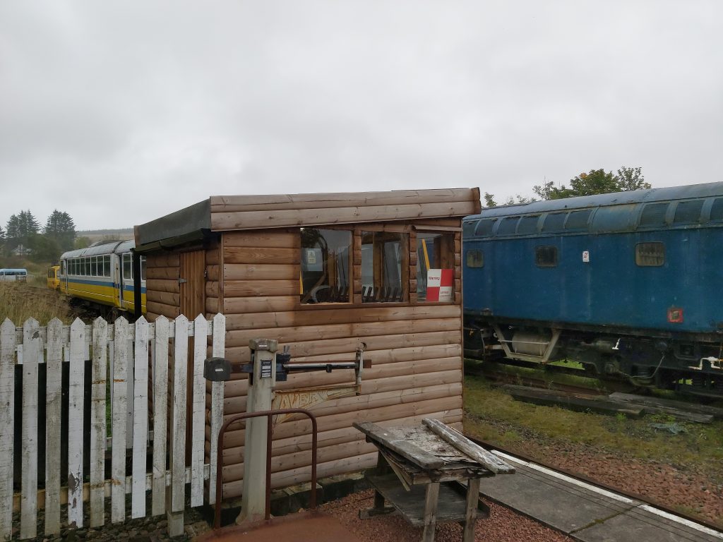 Signal box with trains in background