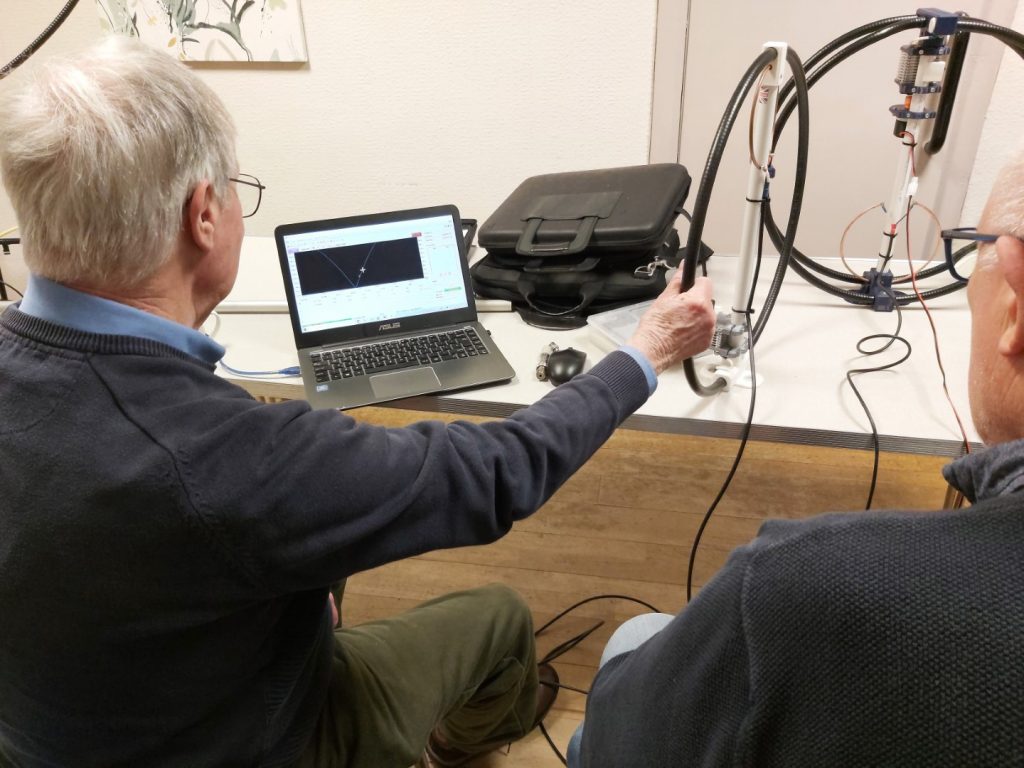 Bob looking at readings on his laptop from miniVNA connected to magnetic loop antenna