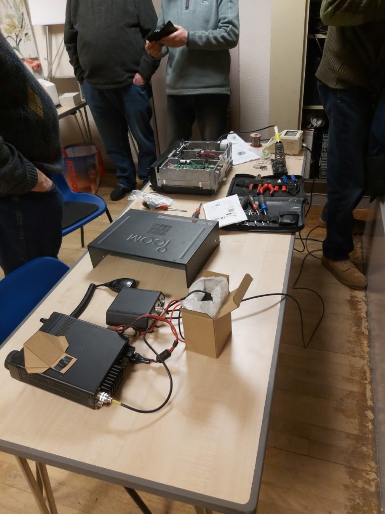 Icom IC-756 Pro II and Icom IC-706 radios on table, 756 with case off